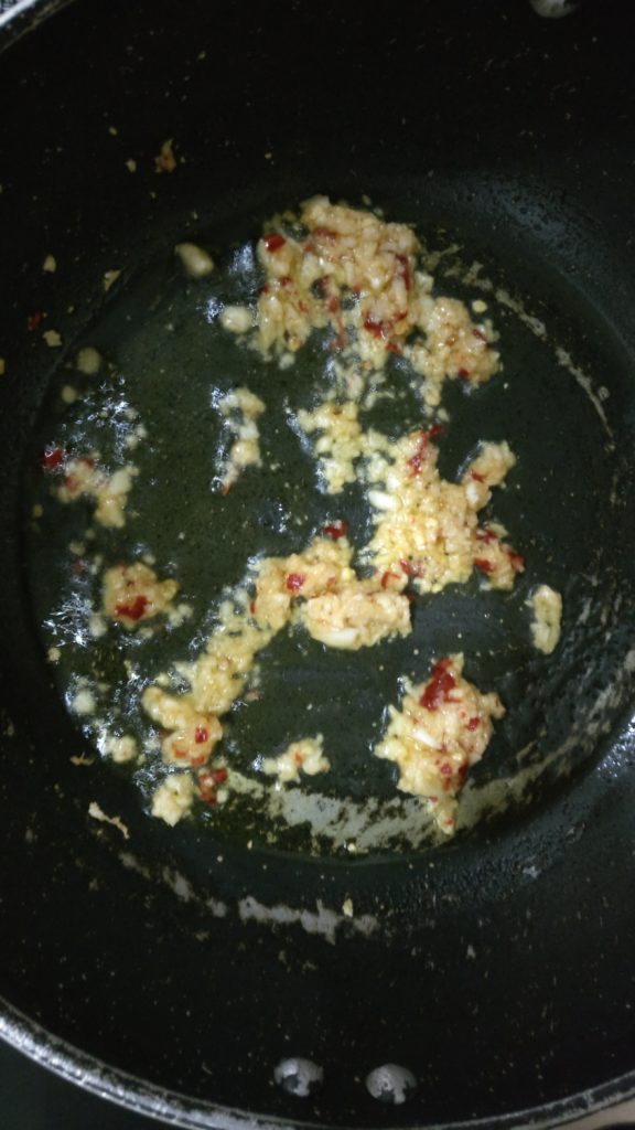 Ginger Garlic And Red Chilli Paste Being Sauteed In Olive Oil