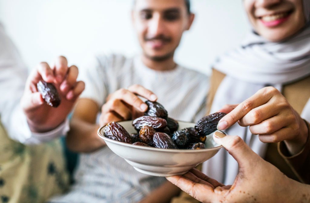 Muslim Family Having Dried Dates As A Snack