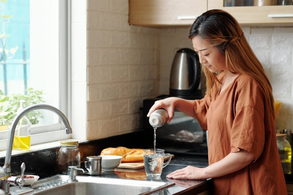 Woman Drinking Hot Water